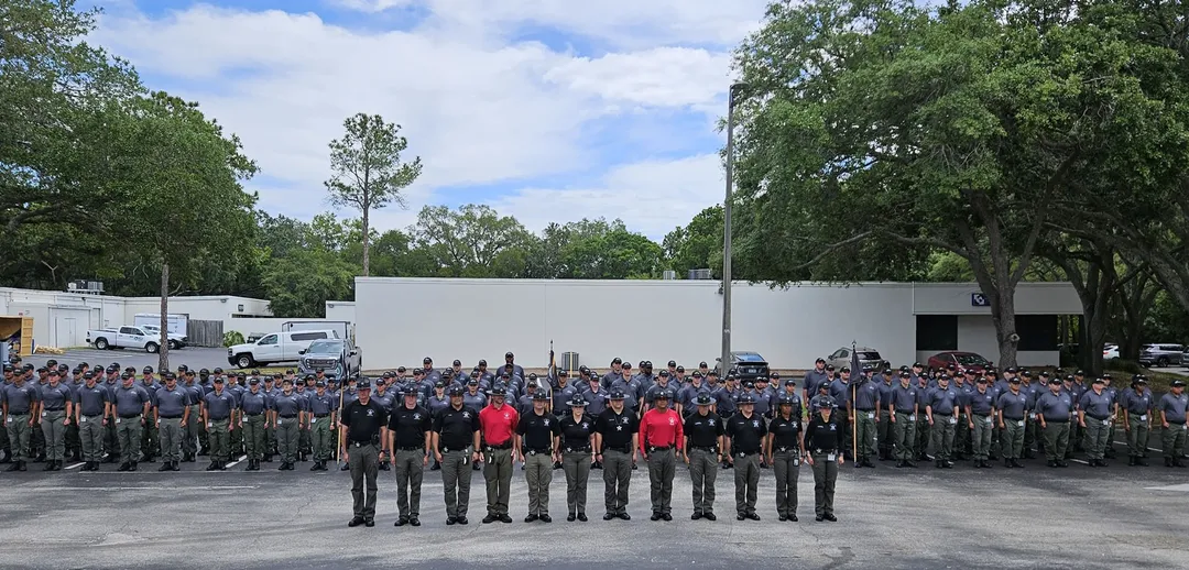 Instructors posing with a training class