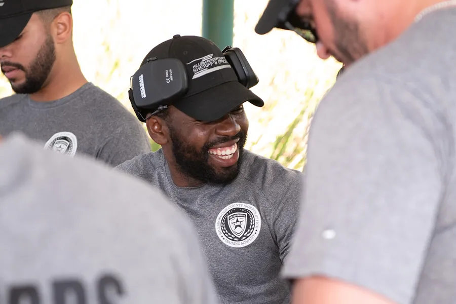 Smiling cadet participating in outdoor training