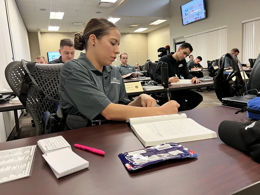 Cadet taking notes during instructional session