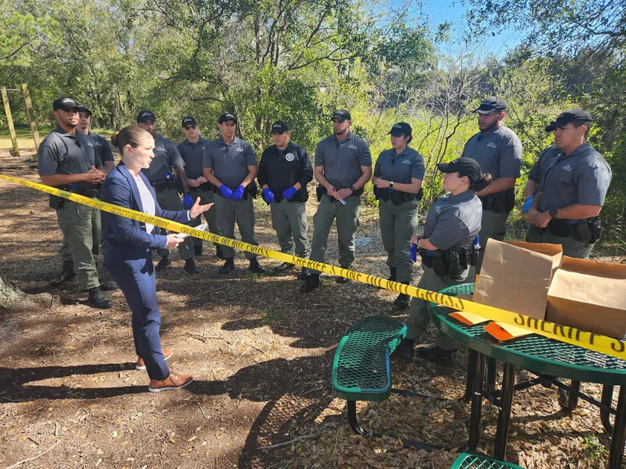 Instructor leading outdoor training session with cadets