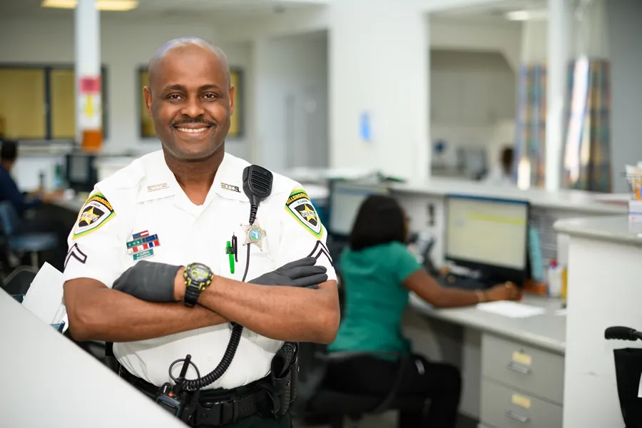 detention deputy smiling inside detention center