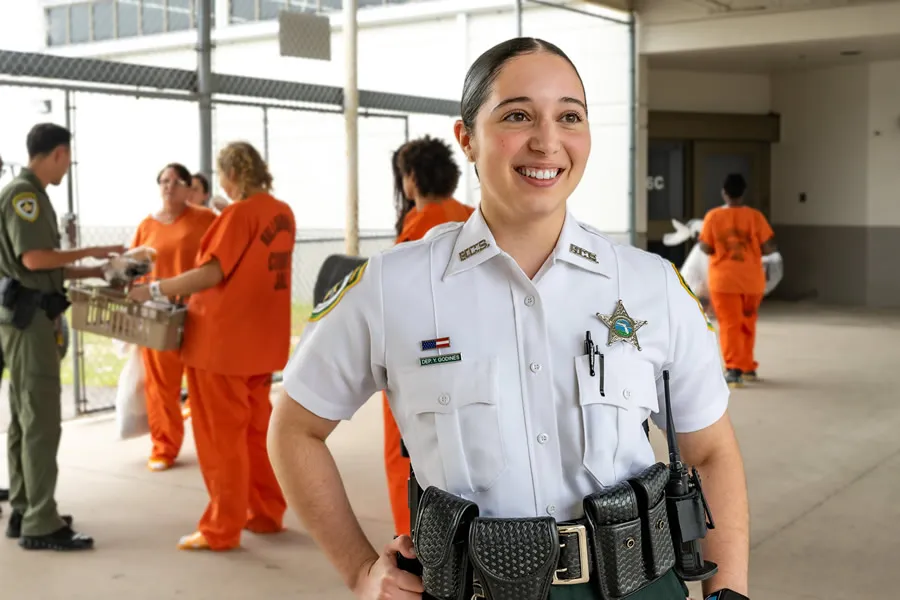 detention deputy smiling in open outdoor area