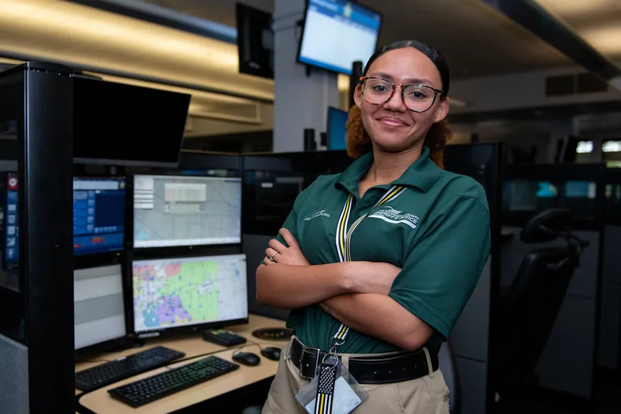 confident professional employee in communications center