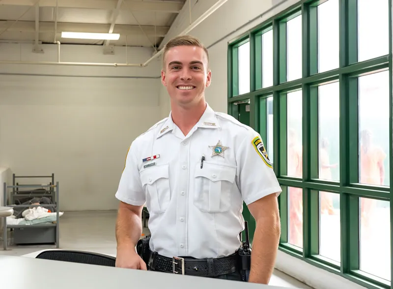 deputy in uniform smiling warmly