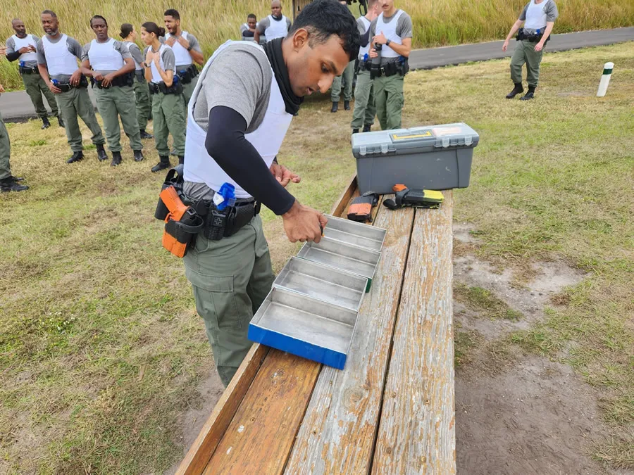 A participant performing the weapon unload activity durinbg the PAA.