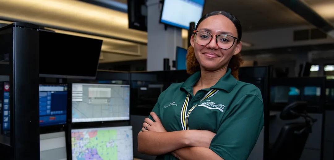 Civilian employee smiling warmly.